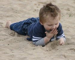Aussie Boy Enjoying The Sand 