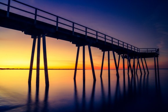A Pier Into The Sunset