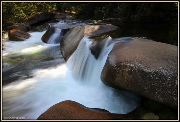 Water Fall Over A Boulder