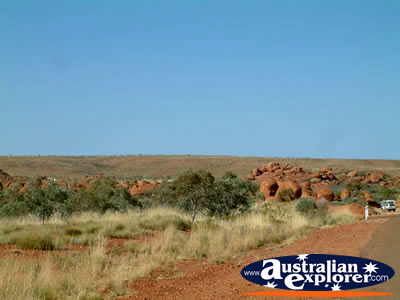 Road alongside Devils Marbles . . . CLICK TO VIEW ALL DEVILS MARBLES POSTCARDS