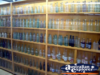 Empty Glass Bottle Display at Winton Waltzing Matilda Centre . . . CLICK TO VIEW ALL WINTON POSTCARDS